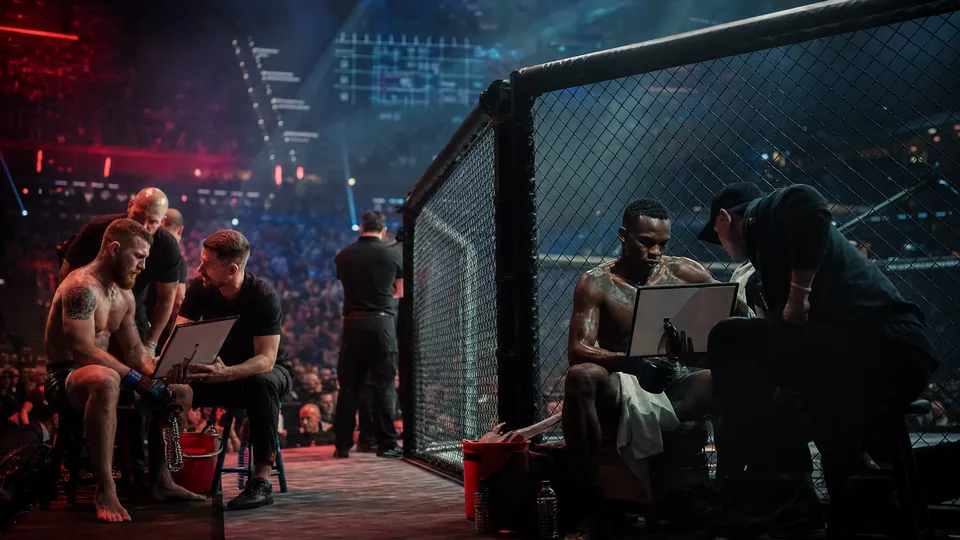 MMA fighters between rounds under arena lights with subtle schedule and activity graphics